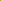 A close-up of a bright neon yellow lightweight fabric, twisted in the center creating subtle folds and patterns. The smooth, shiny texture of the vibrant fabric is visible, highlighting its soft appearance. This fabric is called Lining - Lime - 150cm by Super Cheap Fabrics.