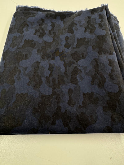 The REMNANT - Cotton Sateen- 200cm from Super Cheap Fabrics is a dark blue fabric with a black camouflage pattern, measuring 115cm wide by 200cm long, shown folded on a light surface.