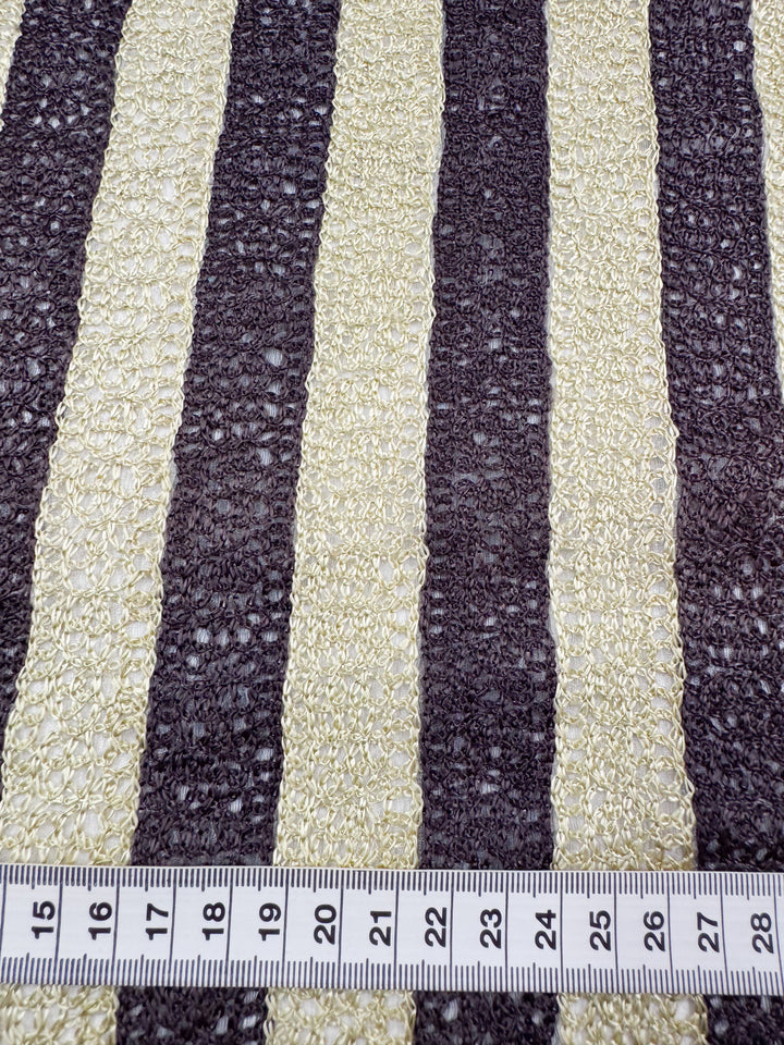 A close-up of Super Cheap Fabrics' Pure Silk - Tuxedo Twist shows luxurious cream and dark brown vertical stripes. At the bottom, a measuring tape displays 11 to 27 cm.