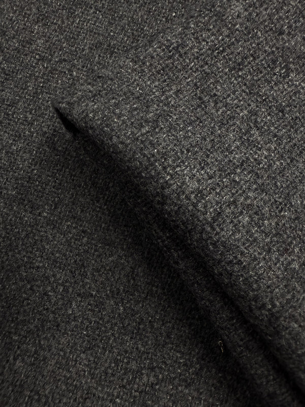 Close-up of Super Cheap Fabrics' Hopsack Wool in Charcoal (150cm), highlighting its coarse, textured weave and soft, slightly fuzzy surface.