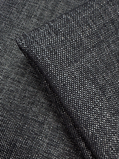 Close-up of Upholstery Tweed - Dresden Charcoal (146cm) by Super Cheap Fabrics, showing its dark gray, finely speckled weave and thick texture—premium upholstery fabric from an Australian wholesaler.