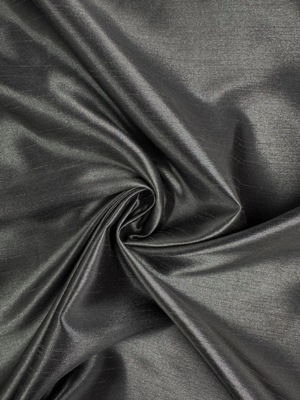 Shantung Satin - Charcoal by Super Cheap Fabrics is a metallic gray satin fabric, 150cm wide, with a smooth texture and elegant folds that catch the light for gentle highlights.