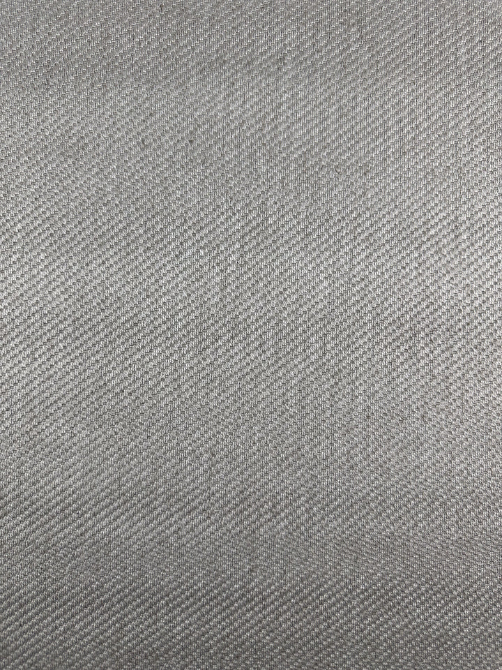 Close-up of Super Cheap Fabrics' Twill Upholstery - Rex 370 (150cm), featuring a gray, textured deadstock surface with a subtle diagonal weave for a soft, slightly reflective look.