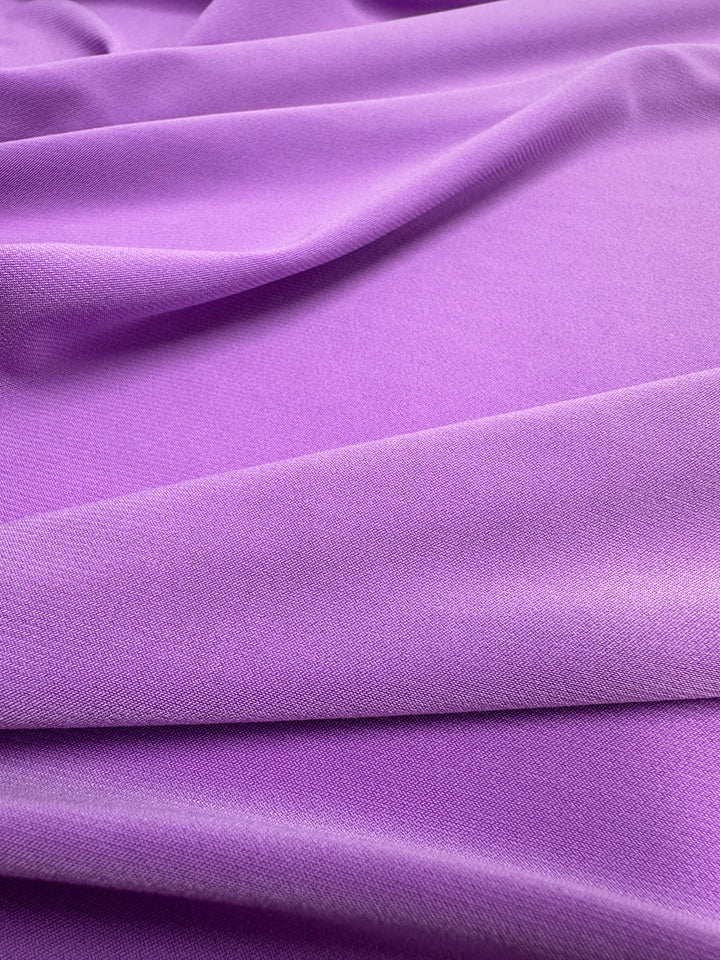 The ITY Knit - Iris Orchid by Super Cheap Fabrics is a medium-weight, silky fabric with a subtle sheen, draping beautifully in soft folds. Width: 150cm.