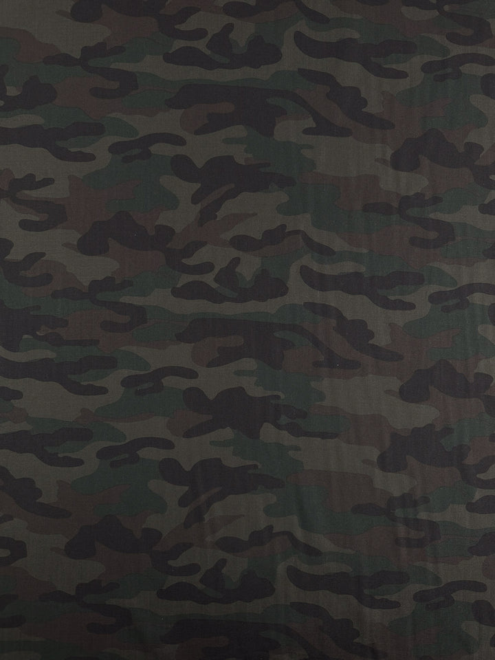 Super Cheap Fabrics' Printed Linen - Military - 150cm features a green and brown camouflage pattern with wavy, irregular shapes, ideal for military clothing, gear, or stylish home decor.
