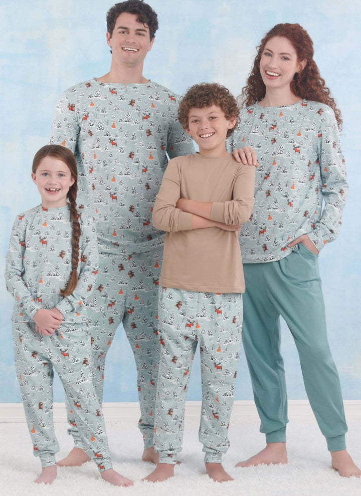 A family of four models the Super Cheap Fabrics Pattern - Simplicity - S9861 knit loungewear: parents in long sleeves and pants, kids in beige tops and matching bottoms, all against a light blue backdrop, showcasing a cozy winter-themed collection with smiles.