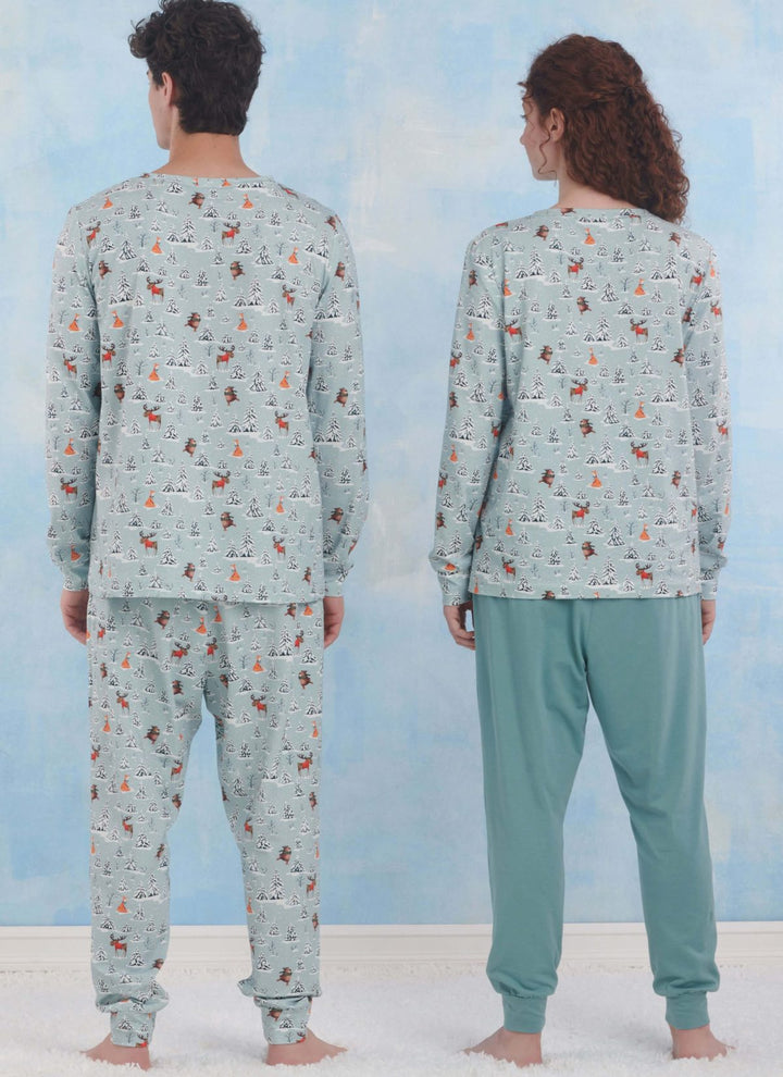 Two people are seen from the back in matching loungewear from Super Cheap Fabrics' Pattern - Simplicity S9861 collection. The cozy set includes a light blue top with winter prints and solid pants, all styled effortlessly against a soft blue wall on a white surface.